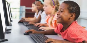 students using computers in classroom data analytics